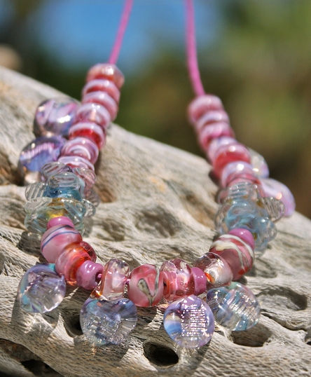 Mixed lightly faceted organic style glass beads